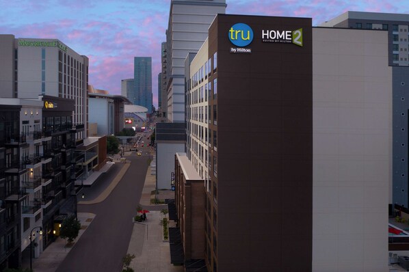 A hotel named 'tru HOME 2 by Hilton' with a modern architectural design, located in an urban setting with a clear sky. - Home2 Suites by Hilton Nashville Downtown Convention Center (Nashville)