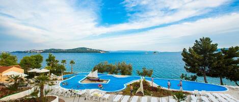 Outdoor pool, open 9 AM to 7 PM, pool umbrellas, sun loungers