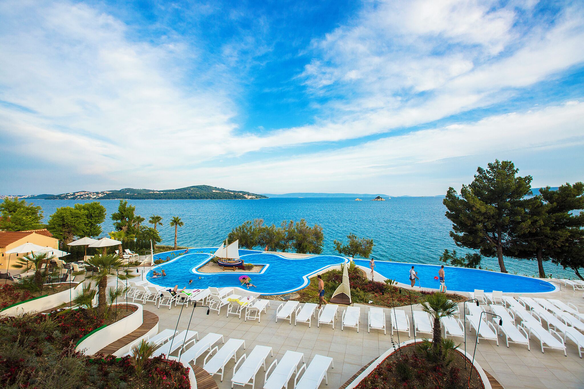 Outdoor pool, open 9 AM to 7 PM, pool umbrellas, sun loungers