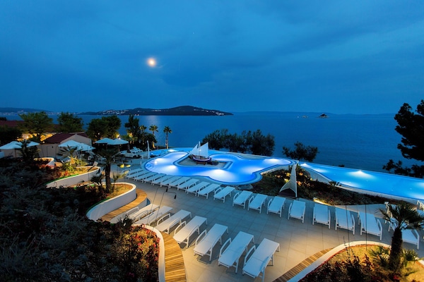 Outdoor pool, open 9 AM to 7 PM, pool umbrellas, sun loungers