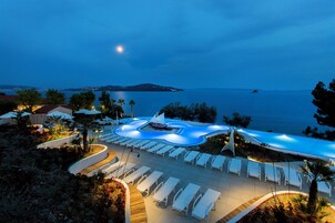 Outdoor pool, open 9 AM to 7 PM, pool umbrellas, sun loungers