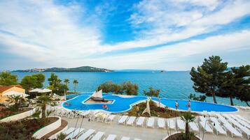 Outdoor pool, open 9 AM to 7 PM, pool umbrellas, sun loungers