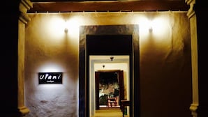 A hallway with a sign reading "Utani Lodge."
