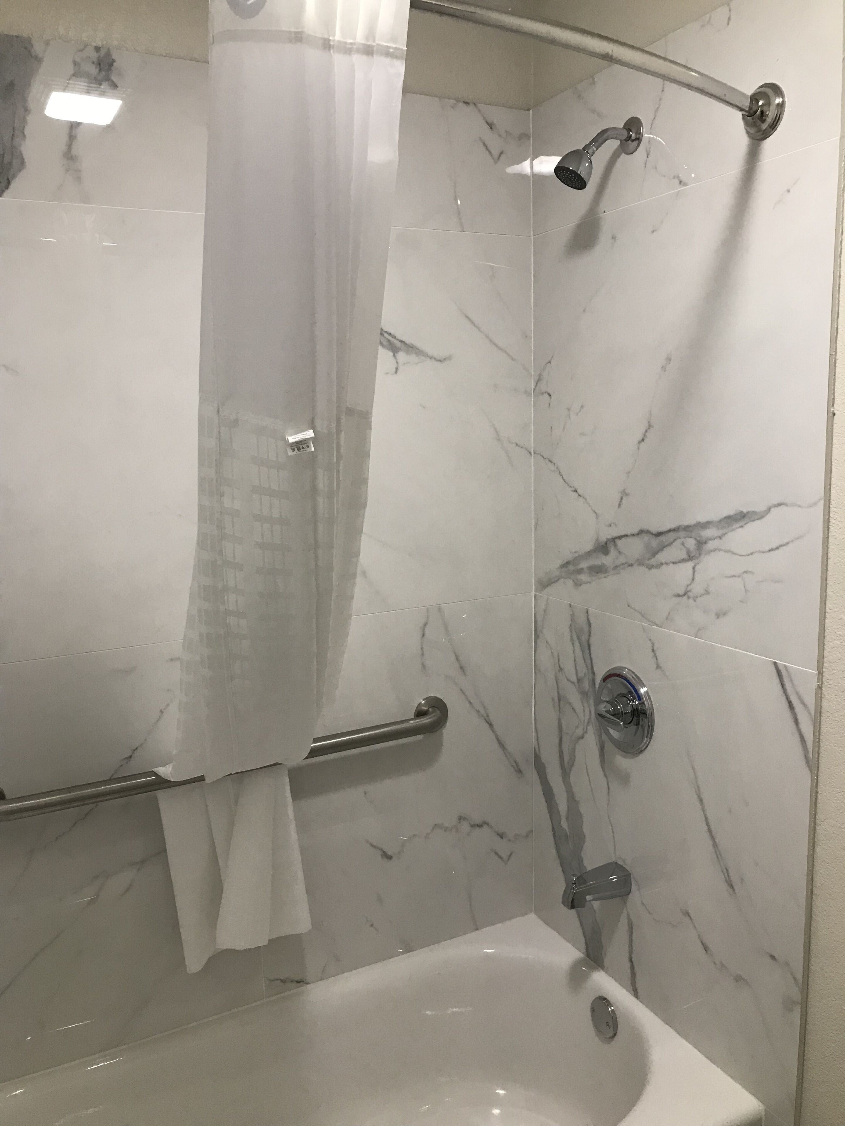 Bathtub, hair dryer, towels