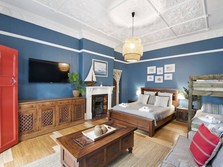 Designer Family Room (Off Courtyard) | Minibar, blackout drapes, iron/ironing board, WiFi (free)