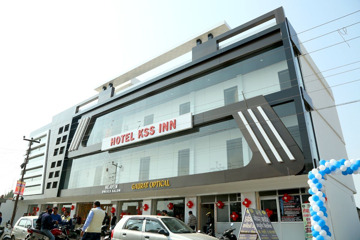 A hotel with a modern facade, including a prominent sign for Hotel KSS Inn.