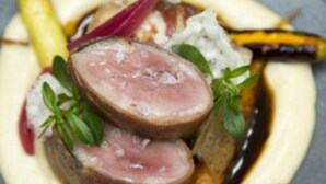 A plate of food with sliced meat, vegetables, and a creamy sauce. - Soenam Tsokhang Resort (Paro)