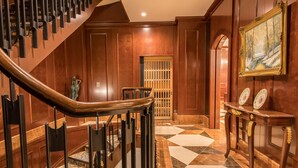 A grand staircase with a wooden handrail and a patterned floor. - IP CITY HOTEL Osaka (Osaka)