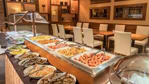 A buffet with various food options and a seating area with tables and chairs. - IP CITY HOTEL Osaka (Osaka)