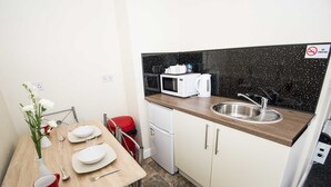 Estudio ejecutivo, varias camas | Cocina privada