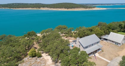 400 feet of private lake front, home and cottage on 3.4 acres, sleeps 16!