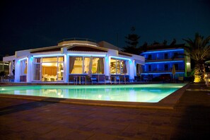 Relax by the pool surrounded by a spacious deck and comfortable seating.