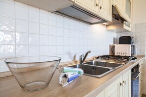 Departamento clásico, 1 habitación | Cocineta privada | Refrigerador con congelador, horno y parrilla de estufa
