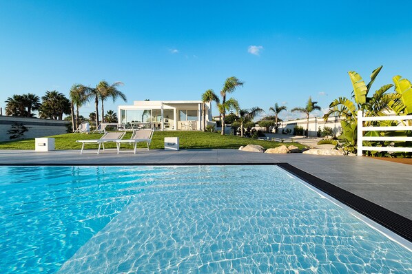 Seasonal outdoor pool, sun loungers