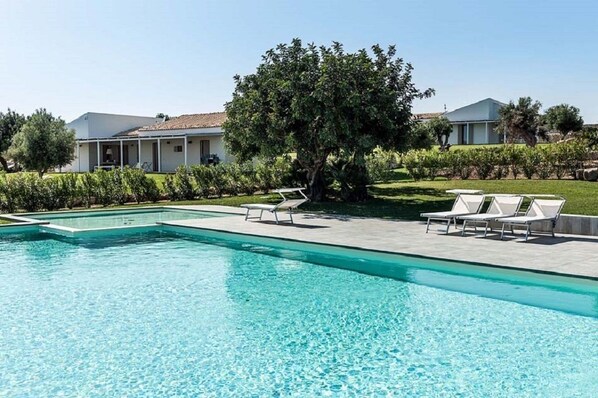 Seasonal outdoor pool, pool loungers