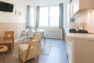 Comfort Apartment | Living area | TV