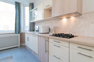 Comfort Apartment | Private kitchen | Fridge, microwave, stovetop, dishwasher
