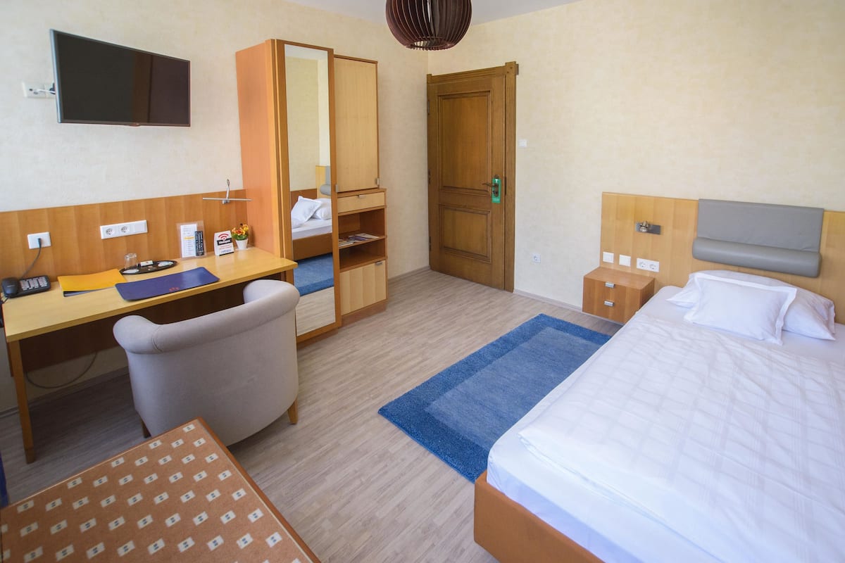 Desk, laptop workspace, blackout curtains, free WiFi