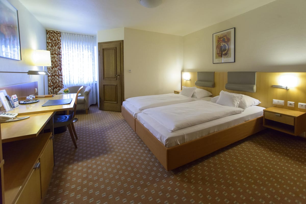 Desk, laptop workspace, blackout curtains, free WiFi