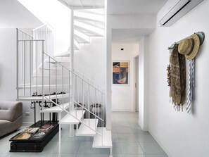 Step up to a stylish space with a central staircase, climate control, and a touch of cultural flair.