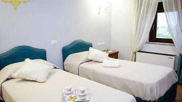 Twin Room | Minibar, in-room safe, desk, free WiFi