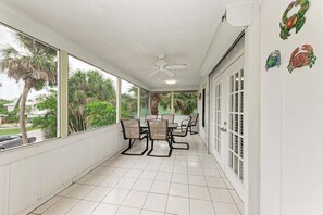 Enjoy meals al fresco in this outdoor dining area with a view of the surrounding landscape.