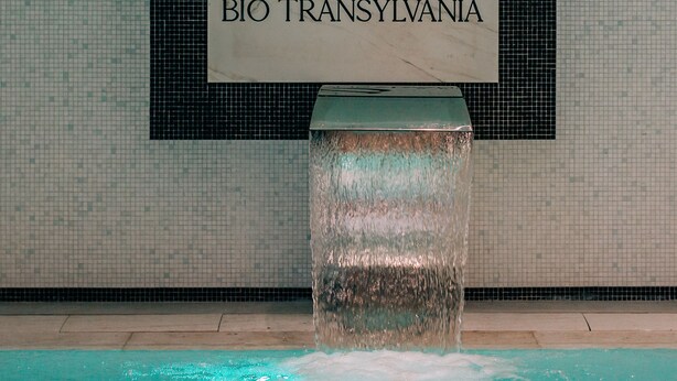 A spa sign with the number 8 and the text "SPA BIO TRANSYLVANIA" against a tiled wall. - Mandachi Hotel & SPA (Suceava)