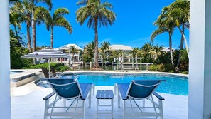 A heated pool - 5 O'Clock Somewhere: Dog Friendly Canal Front, Elevator, Pool, Beach 2 Blocks by Anna Maria Life (Anna Maria)