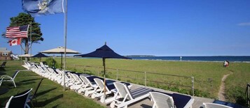 On the beach, sun loungers, beach umbrellas