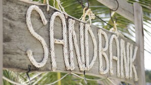 A wooden sign with the word "SANDBANK" written in rope letters. - Sandbank Restaurant & Camping Koh Rong (Koh Rong)