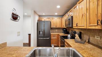 Condo, 2 Bedrooms | Private kitchen | Fridge, oven, dishwasher, coffee/tea maker