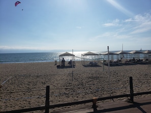On the beach, sun-loungers, beach towels