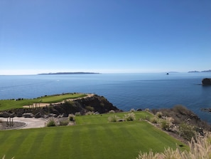 Enjoy a serene golfing experience with breathtaking ocean views and natural surroundings.