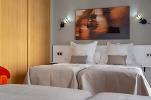 Standard Quadruple Room, Multiple Beds, Non Smoking, City View | In-room safe, iron/ironing board, free WiFi, bed sheets