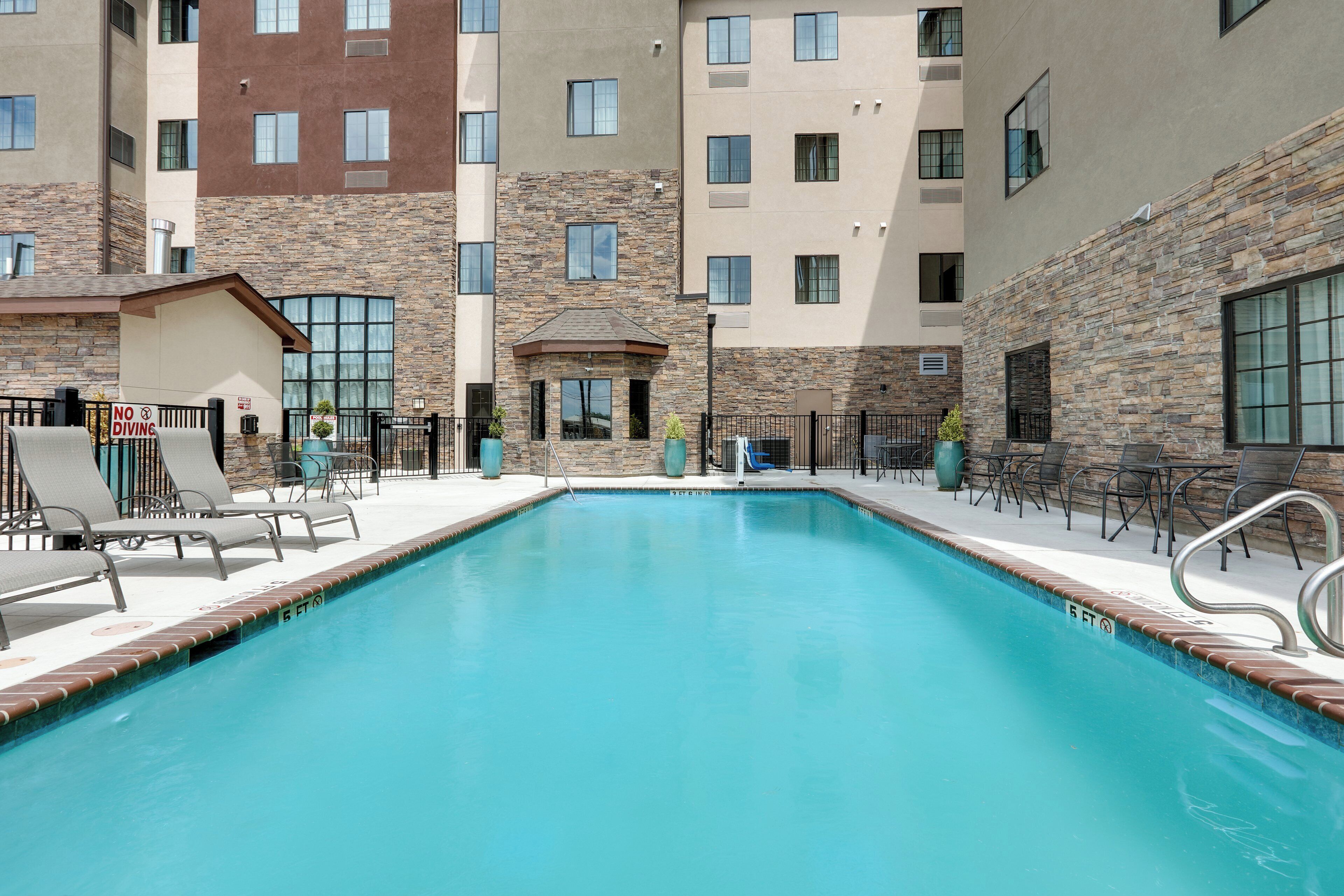 Outdoor pool, open 10:00 AM to 10:00 PM, pool umbrellas, pool loungers