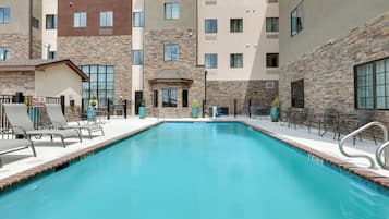 Outdoor pool, open 10:00 AM to 10:00 PM, pool umbrellas, pool loungers