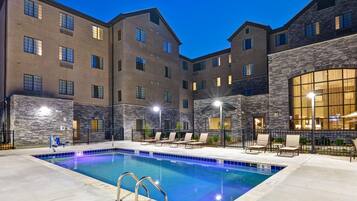 Seasonal outdoor pool, open 9:00 AM to 9:00 PM, pool loungers