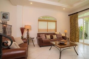 Condo, Multiple Beds (Los Suenos Resort Colina 8E) | Living room | Flat-screen TV - Los Suenos Resort Colina 8E (Jacó)