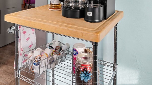 A kitchen area with a coffee maker, a shelf with mugs, and a wall with a motivational quote. - Private Guest House-Hermann MO (Hermann)