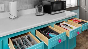 A kitchen with teal cabinets, a microwave, and a toaster on the counter. - Private Guest House-Hermann MO (Hermann)