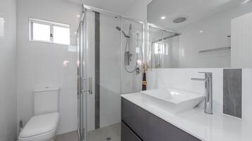 Shower, hair dryer, towels, soap