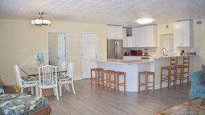 A compact living space with a dining area, kitchen, and seating area. - Island Life at its best (Key Largo)