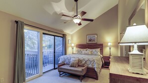 A bedroom with a bed, a nightstand, a desk, a ceiling fan, and a view of the outdoors through a sliding glass door. - New Listing Updated Great Golf Views 3 BR Condo Bikes & Beach Gear included (Hilton Head Island)