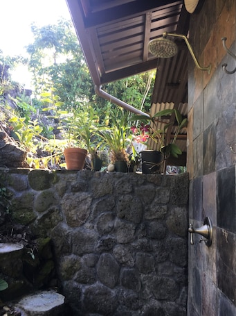 Property grounds. Bungalow 1 with large kitchen, outdoor private shower and 1/2 bath.