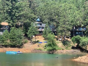 Surrounded by lush greenery and serene waters, this lakeside retreat offers scenic views and a peaceful environment.