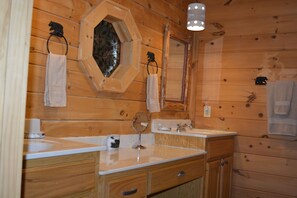 Bathtub, hair dryer, towels, soap