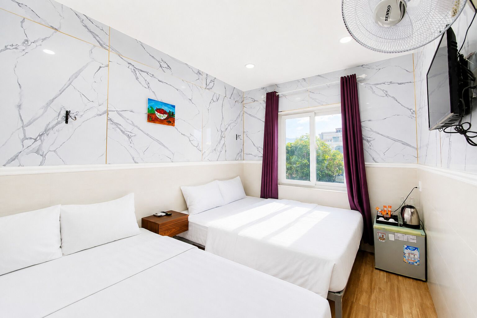 Family Quadruple Room, City View | Pillowtop beds, minibar, soundproofing, WiFi (free)