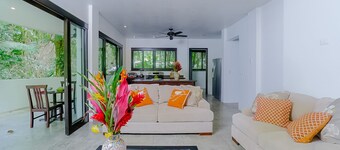 Contemporary ground-level suite with large patio, walk to the beach