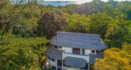 Contemporary ground-level suite with large patio, walk to the beach