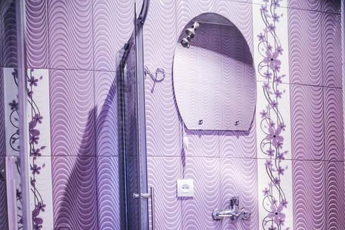 Designer toiletries, hair dryer, bathrobes, slippers